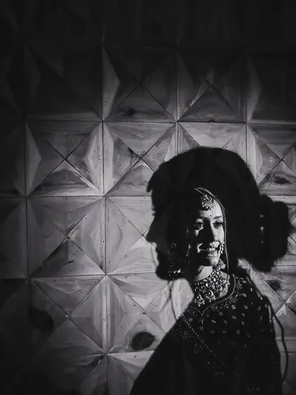 An artistic black and white double exposure portrait of the bride. I use creative techniques like this to add a layer of depth and emotion, turning a simple portrait into a unique piece of art.
