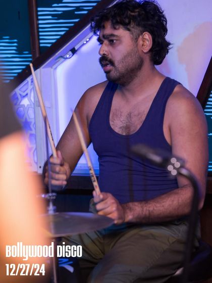 A close-up of the drummer from The Kominas during their live set. I enjoy curating unexpected musical pairings, like a punk band playing Bollywood classics.