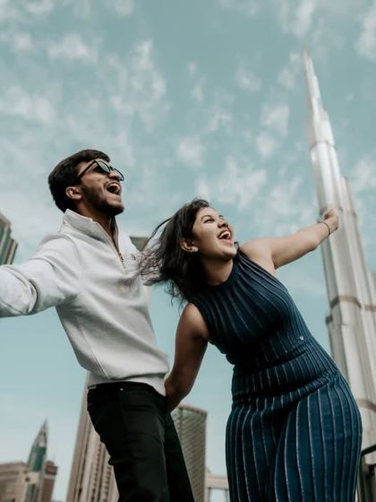 A joyful, carefree moment with the iconic Burj Khalifa in the background. Capturing pure happiness.