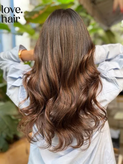 The back view of this stunning mocha balayage, showing off the long, healthy hair.