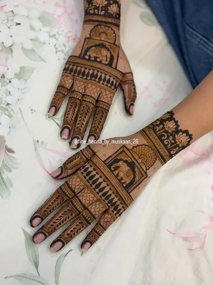 A simple and elegant back-hand design for Rakhi, featuring elephant motifs in a frame.