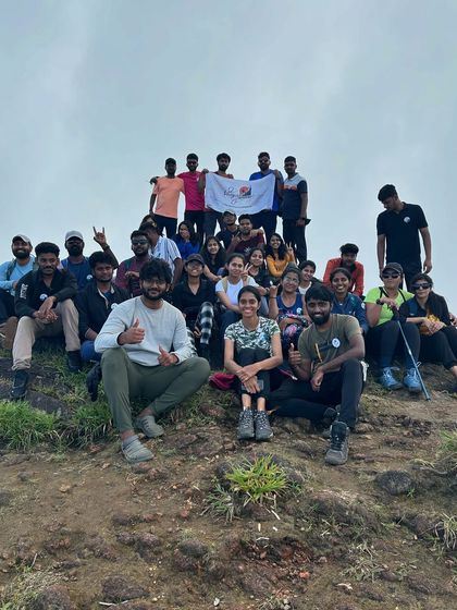 A large group photo celebrating the successful completion of the Kumara Parvatha trek. We love seeing so many people achieve their trekking goals.