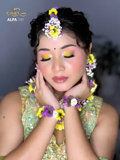 A serene portrait capturing the fresh and dewy finish of the makeup, ideal for a daytime Haldi function.