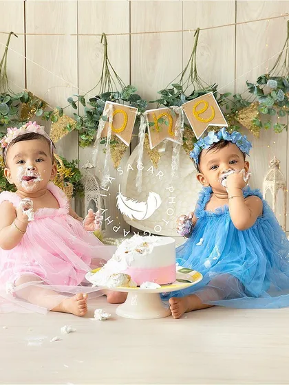 Double the fun for a twin cake smash. I coordinate the outfits and setup to create a beautiful, cohesive look while still capturing each baby's unique reaction to their first taste of birthday cake.