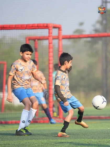 An action shot from the Leno Premier League, with our player focused on controlling the ball and making the next move.