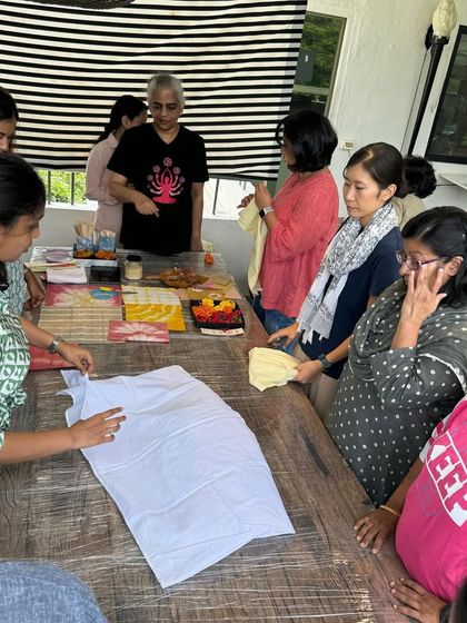 I always start my workshops by demonstrating different folding and tying techniques. This helps everyone understand how to create various patterns before they start on their own projects.