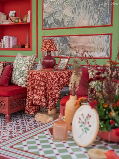 A vignette showing the custom-printed fabrics and decor items, including Ajrak-style patterns on cushions and lampshades, adding layers of texture and tradition.