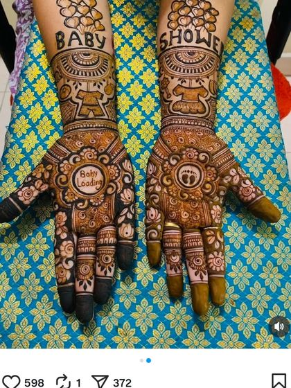A clear, full view of the popular "Baby Shower" themed mehandi, showing how the designs on both hands work together.