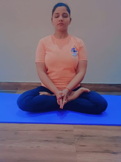 A student demonstrates a variation of Yoga Mudra, a powerful posture for introspection and calming the mind. In my therapeutic yoga sessions, we use such asanas to address the root causes of conditions like anxiety disorder.