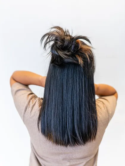 This messy top knot was created using our Donut Bun extension. It's a fun and stylish way to wear your hair up, adding volume and texture for a chic, effortless look.