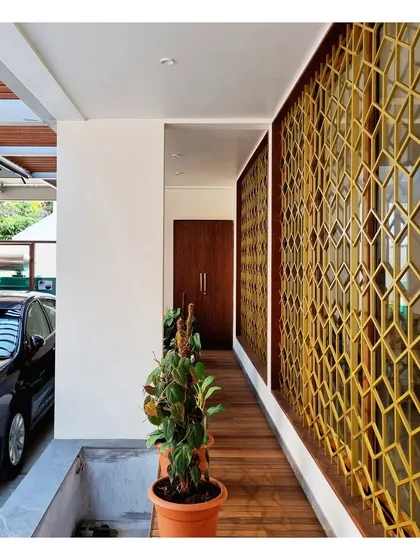 The planter box and walkway alongside the decorative window grills, showing how we integrate our designs with landscaping.
