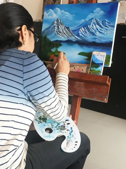 Here is one of my students completely absorbed in her work, painting a peaceful mountain landscape. My studio is a calm space where you can unwind, focus, and let the creative process take over. It is your time to relax and connect with your inner artist.