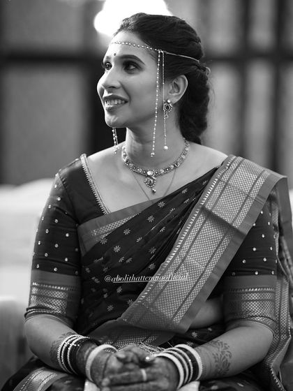 A timeless black and white portrait of Shweta. Her natural beauty is the focus, enhanced by a simple and elegant makeup application.