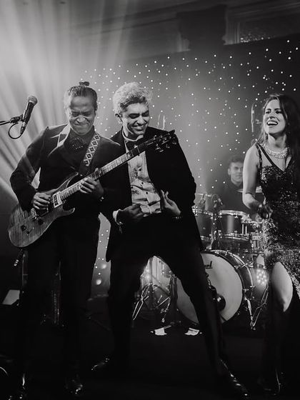 The bride and groom rocking out on stage with the live band. I love capturing these high-energy, unexpected moments.