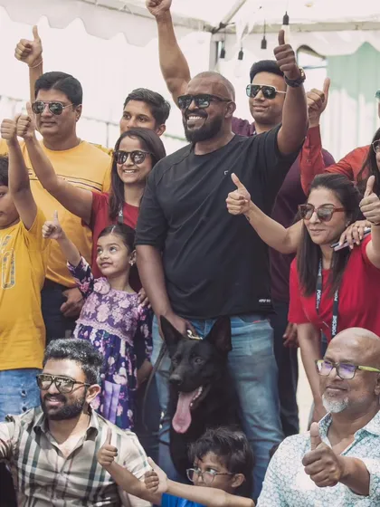 Thumbs up from the crowd. It's always rewarding to see families and their dogs enjoying events together.