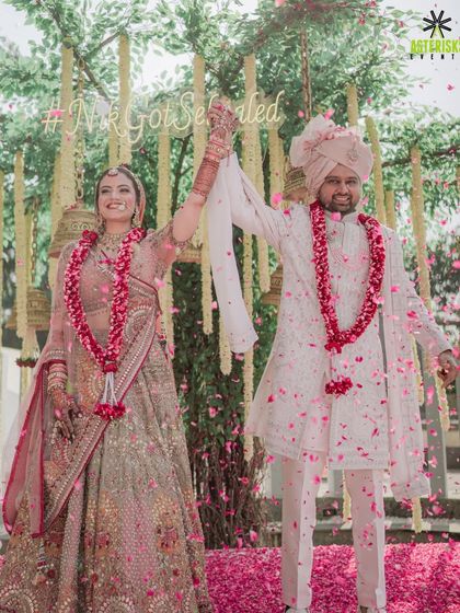 That triumphant moment right after the Varmala, showered in petals and blessings. We plan for these picture-perfect, joyous conclusions to your rituals.