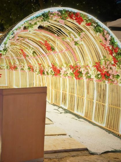 Our floral and light tunnel, ready for an event. It serves as a grand entrance and a stunning backdrop for photos.