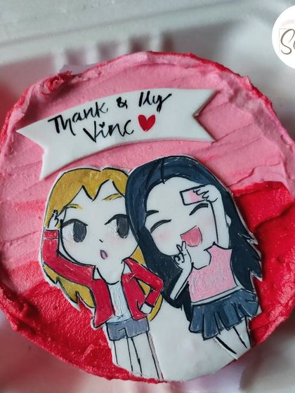 I love using fondant art to recreate your favorite photos. This bento cake features a hand-drawn version of a selfie of two friends, capturing a fun memory in an edible format.