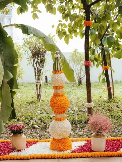 A beautiful floral rangoli and marigold installations at the entrance. We used organic banana trees and traditional flower arrangements to create a warm and auspicious welcome.