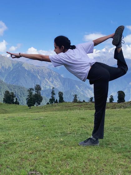 Finding grace in Natarajasana (Dancer's Pose) amidst the stunning Himalayan landscape. My practice is my anchor, wherever I am.