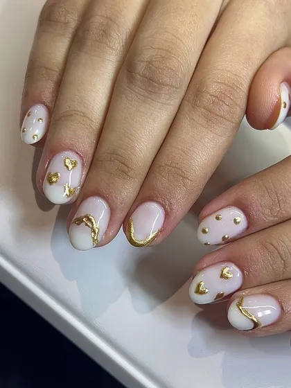 A cute and romantic set with tiny gold hearts and accents on a white base.