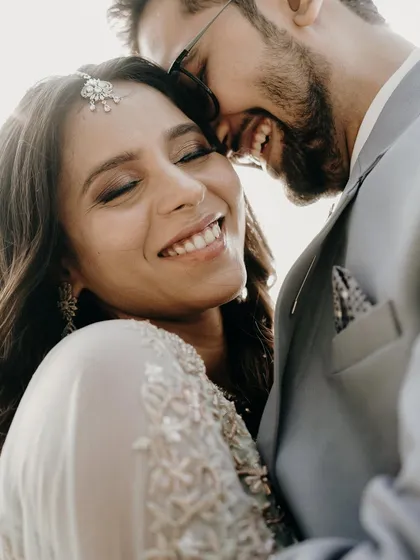For me, the most beautiful portraits are the ones where you forget the camera is there. This close-up from an engagement shoot is pure happiness, capturing a genuine laugh and the warmth of a loving embrace.