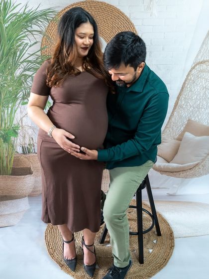 A sweet couple's portrait in our new boho studio setup, complete with a hanging chair and natural textures.