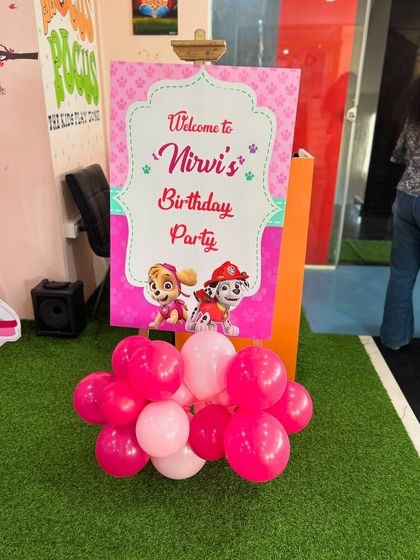The welcome easel for the pink Paw Patrol party, featuring Skye and Marshall.
