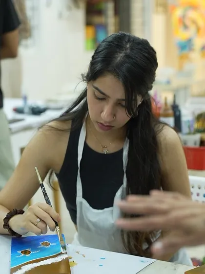 A student enjoys a weekend workshop at our studio. These sessions are a great way to try something new and de-stress.