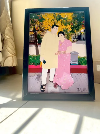 This custom illustrated frame is placed on the floor, catching the sunlight beautifully. It shows how my artwork can be a stylish addition to your home decor, preserving a special memory in an artistic way.