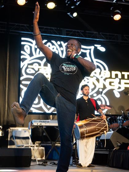 The iconic Bhangra dancer Kala Sher in a Basement Bhangra t-shirt. My events have a legacy, and the merchandise allows the community to be a part of that story.