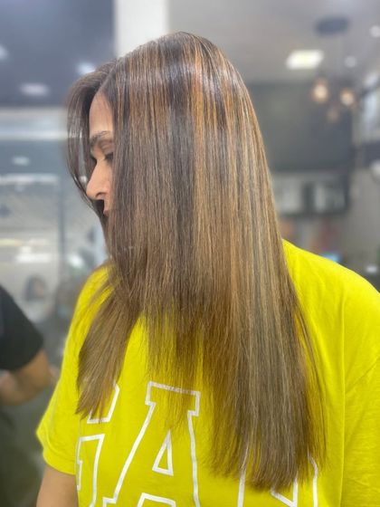 This client's hair was transformed with a straightening treatment that also enhanced her existing color. The result is smooth, manageable hair that looks healthy and vibrant.