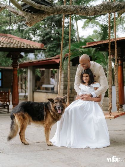 Even furry family members are part of the story. A couple shares a moment on the swing with their beloved dog, a heartwarming and personal touch.
