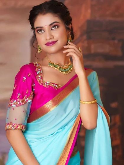 A lovely series of a model in a light blue and pink saree, wearing our simple green bead choker. This is a perfect look for a bridesmaid or a guest at a wedding.