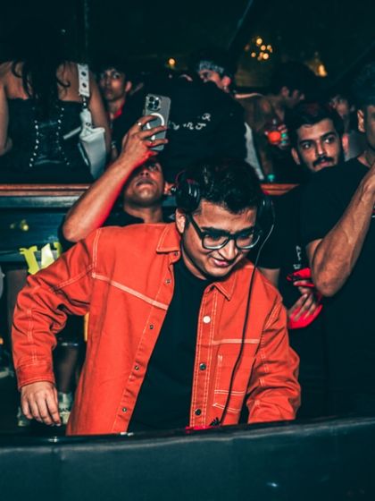 A focused moment from the Halloween gig. Even with the costumes and decorations, it's all about delivering a solid set.