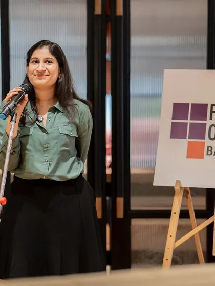 A performer smiles at the audience during our "Break the Boundaries" event. The evening was filled with empowering poetry and heartfelt stories.