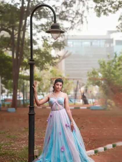 A full-length shot of the model in her beautiful gown, taken outdoors to show the makeup in natural light.