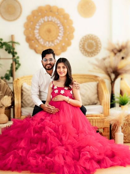 A happy couple's portrait on our cane sofa, perfectly capturing their excitement.