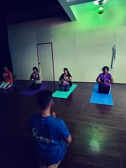 Guiding my students through a seated meditation at the beginning of class. We start by centering ourselves and setting an intention for our practice.