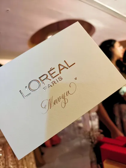 A close-up of the personalized card I created for Navya Nanda at the L'Oréal event. The simple elegance of calligraphy adds a layer of luxury and thoughtfulness to the brand's gift.