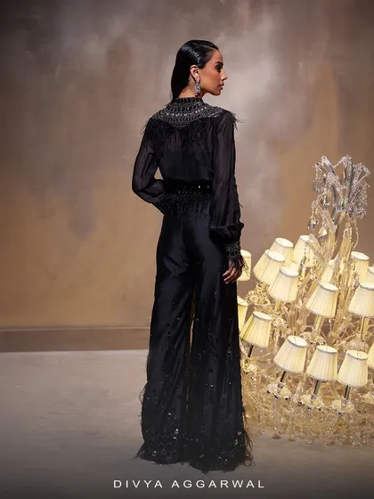 The back view of the Amore Pant Set, showing the clean lines of the sheer top and the continuation of the feather details on the pants.