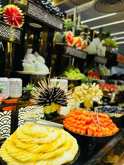 The fruit display is a feast for the eyes, with a vibrant mix of colors, shapes, and textures.