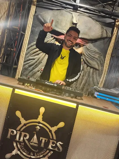 Pointing up, signaling the energy is about to go to the next level. The pirate-themed decor at this Nagpur club was really cool.