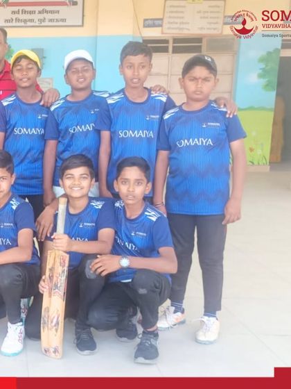 A group of the U-14 boys' tennis cricket champions with their coach, celebrating their qualification for the state-level tournament.
