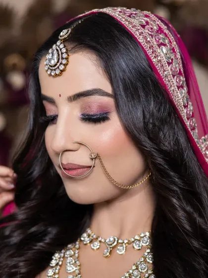 This close-up showcases a beautiful pink cut-crease eye makeup look. My students practice these advanced techniques to build confidence for real client work.