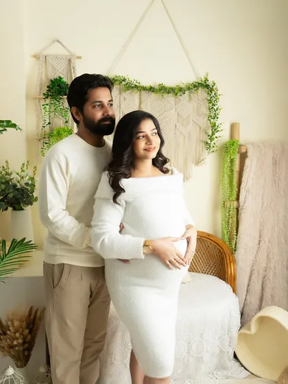 A classic standing pose for a couple's maternity portrait. I direct clients to look towards the light, creating a hopeful and forward-looking mood.