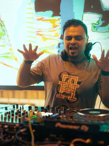 A shot of me with my hands up, feeling the music.