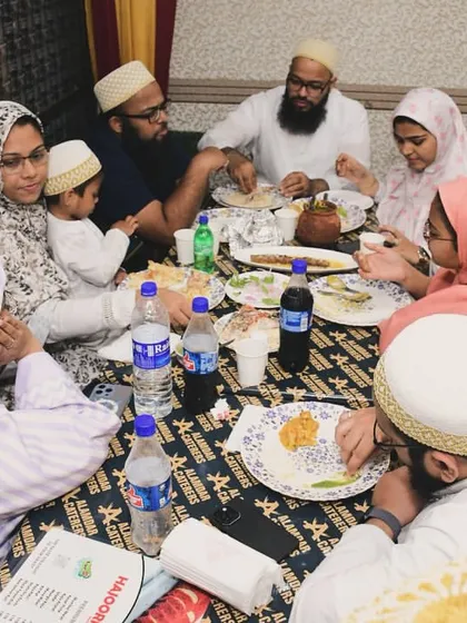A family enjoying their meal in our AC hall. We provide a comfortable setting for your Iftar.