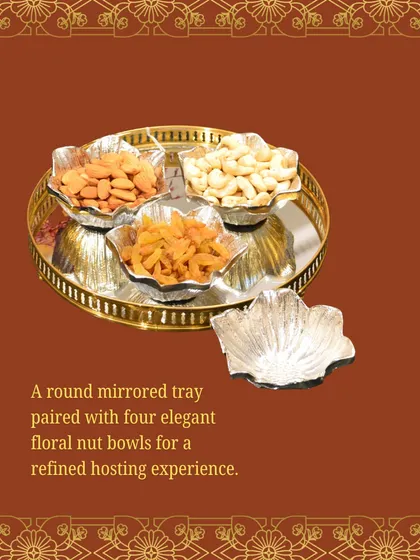 A round mirrored tray paired with four elegant floral nut bowls. This set offers a refined hosting experience, perfect for serving snacks during a pre-wedding function.