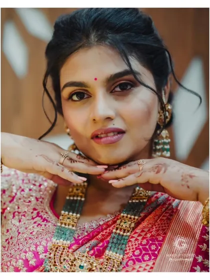 A duplicate of image 179, showing a playful and cute portrait of Varsha. Her soft makeup and romantic hairstyle make her look youthful and fresh.